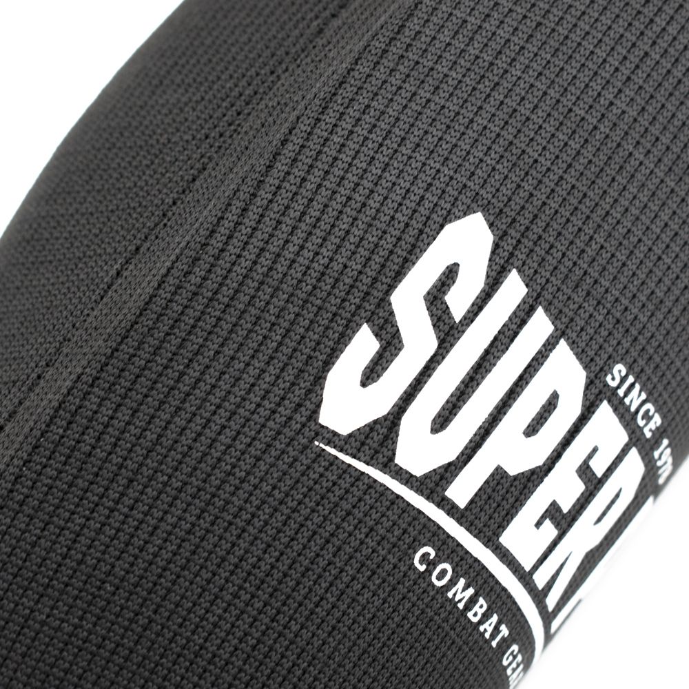 Super Pro Combat Gear Schienbein- und Spannschutz - Defender - Schwarz / Weiß Super Pro Combat Gear Schienbein- und Spannschutz - Defender - Schwarz / Weiß